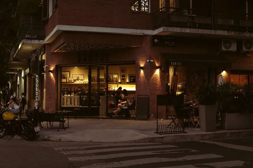 Fachada de SĀNTAL Colegiales de noche en Conde 1200, esquina Lacroze, Buenos Aires
